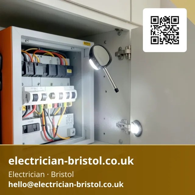Small inspection mirror on a stick being angled to check behind a consumer unit's circuit breakers with a torch