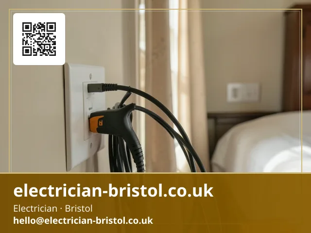 Loop impedance tester clipped to a socket faceplate mid-inspection