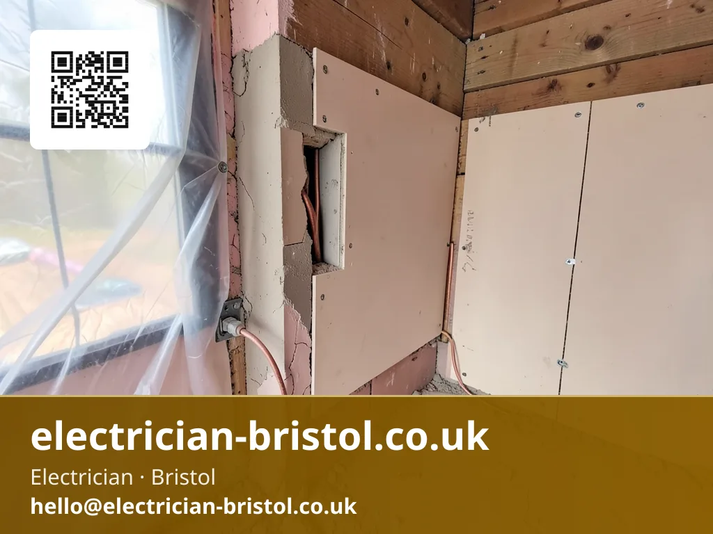 Back box being fitted into a freshly cut plasterboard opening