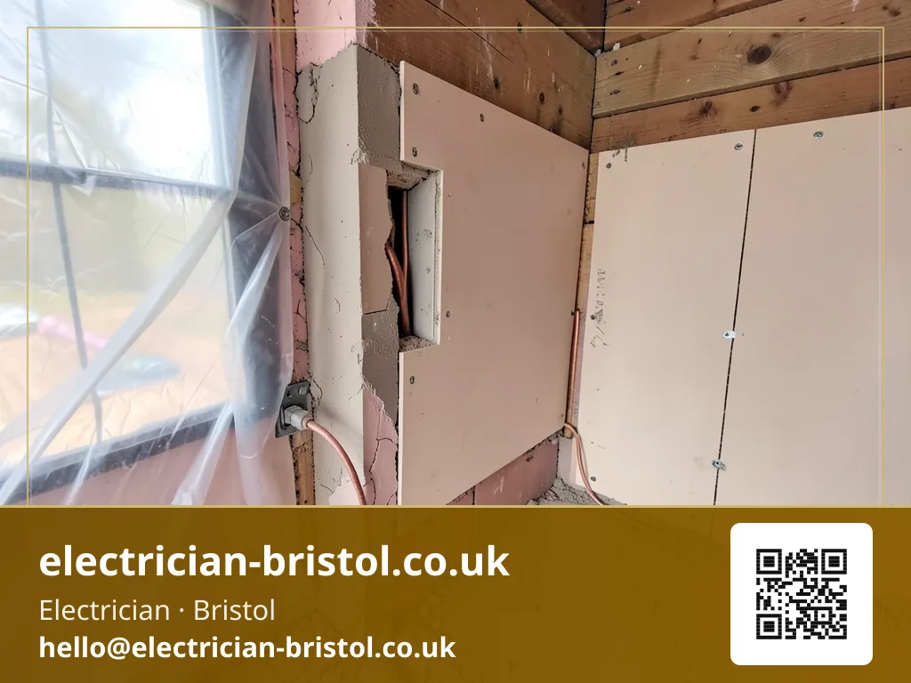 Back box being fitted into a freshly cut plasterboard opening