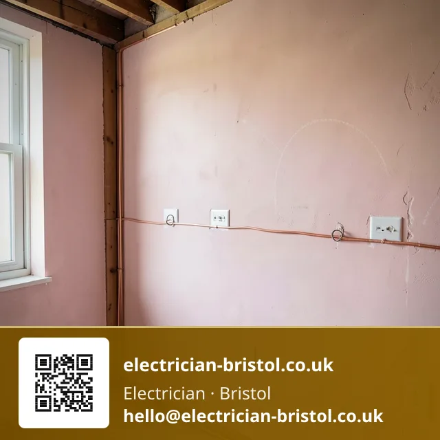 First-fix wall marked with chalk crosses for socket and switch positions