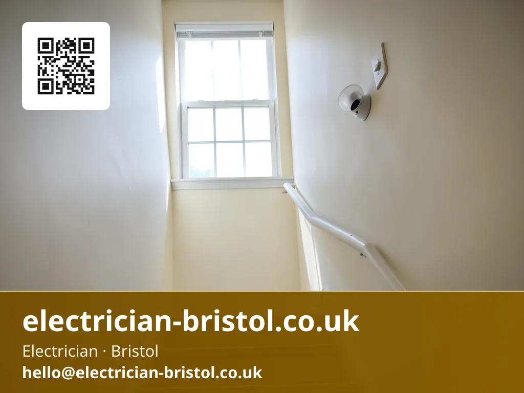 Communal stairwell light fitting being checked in a converted house